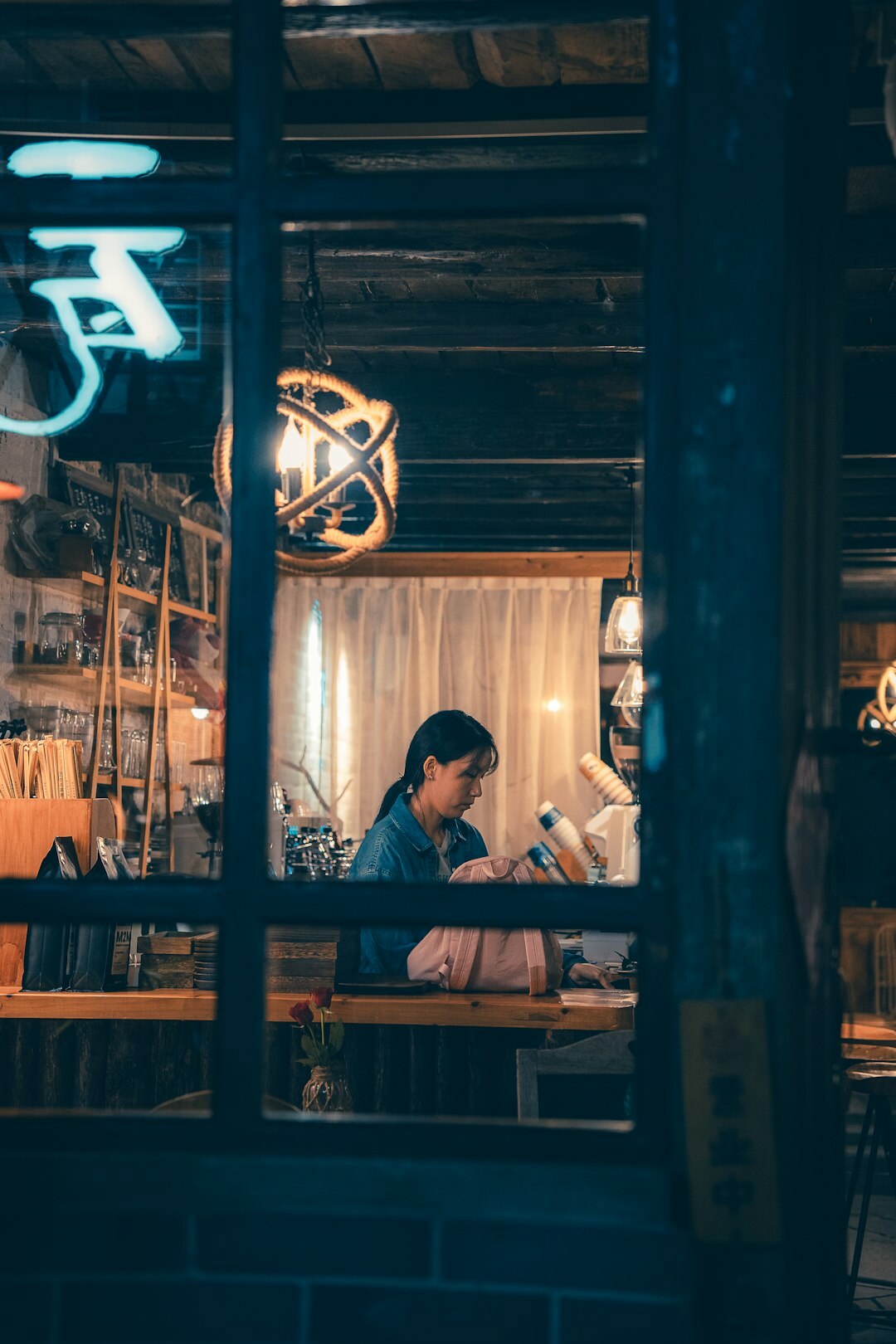woman reading book in cafe